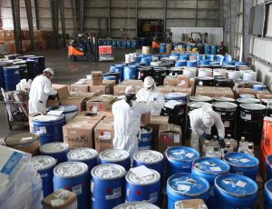 Veolia team works together processing waste containers
