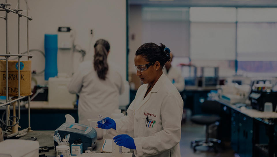 A Veolia employee in a laboratory tests water