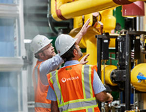 Veolia engineers observing equipment