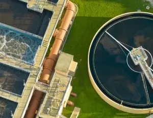 A wastewater treatment facility is seen from an aerial view