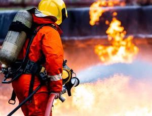 A firefighter uses AFFF