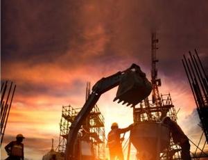 A Veolia crew manages a capital program for facility upgrades, with sunset in the background