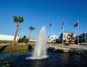 The Tampa Bay facility is seen with a water fountain in the foreground