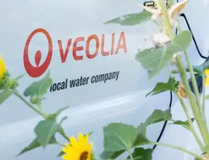 A close-up view of the Veolia logo on the side of a truck