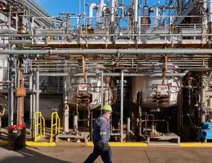 A Veolia employee walks through a processing facility