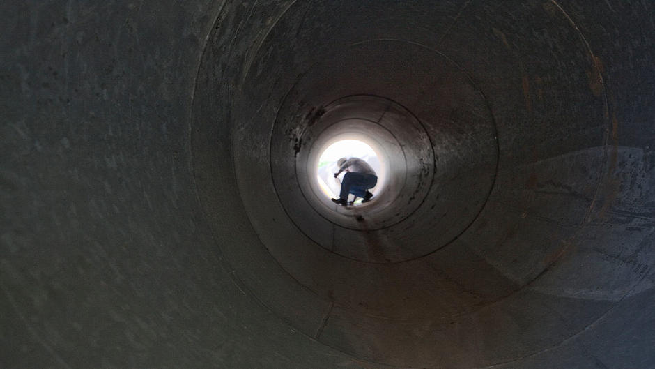 Man inside a pipe