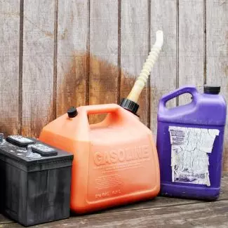 An old car battery and gasoline tank 