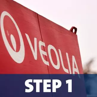 A close-up view of the Veolia logo on the side of a truck