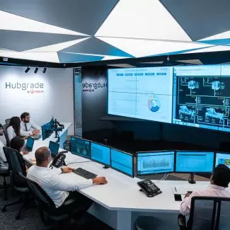 Veolia team members analyze energy data in a Hubgrade command center