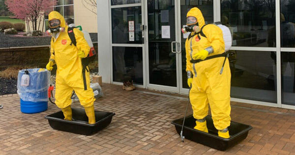 Veolia employees in decontamination gear